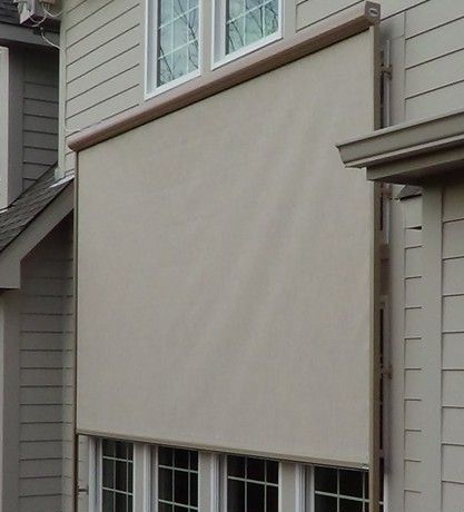 A residential window equipped with a solar screen