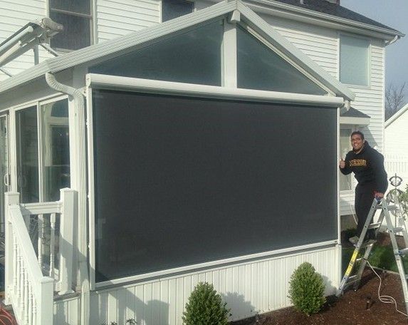 Sunroom covered with a solar screen