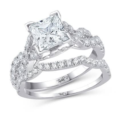 Diamond engagement ring with a princess-cut center stone and twisted, diamond-studded band.