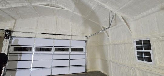 A garage with a garage door and a window.