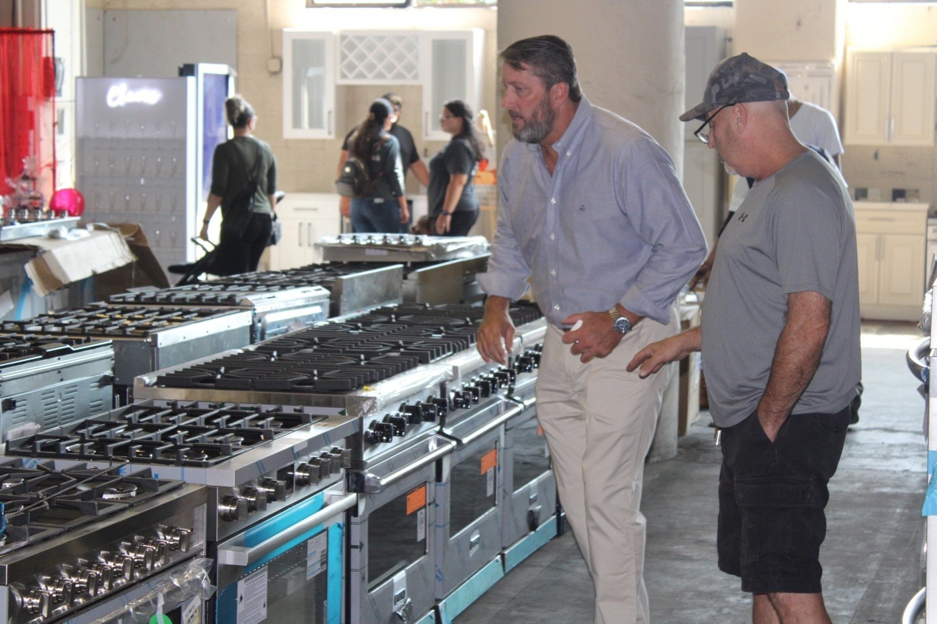 guy shopping for stove