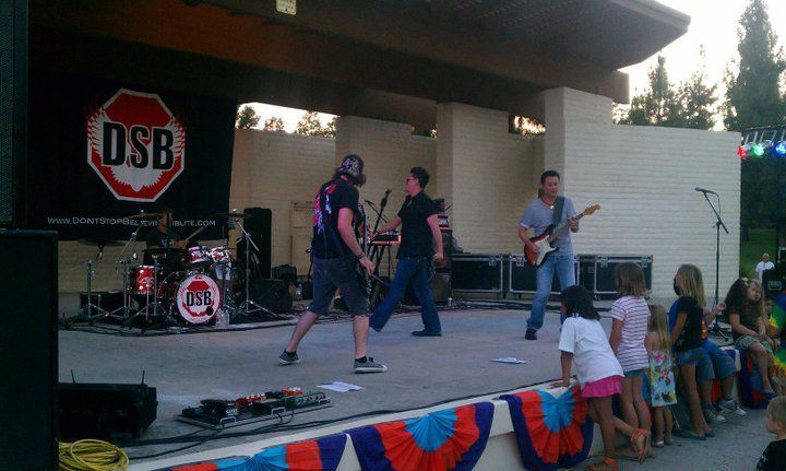 Band DSB performing on outdoor stage, audience watching.
