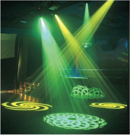 Green and yellow spotlights illuminate a dance floor with swirling and circular light patterns.