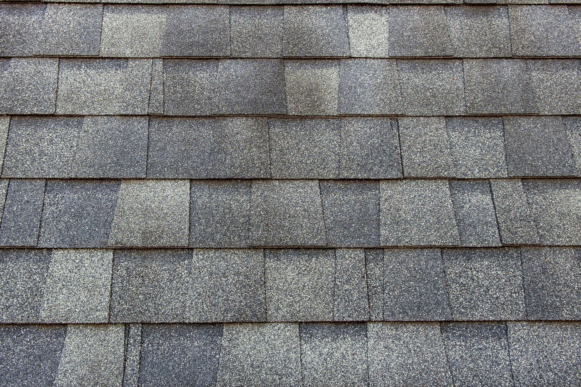 Gray asphalt roof shingles.