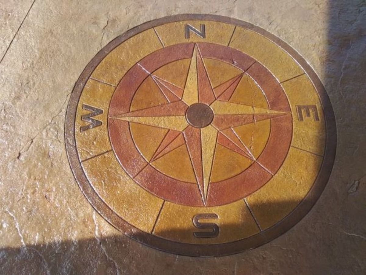 Compass rose design in a circular pattern on a patio.
