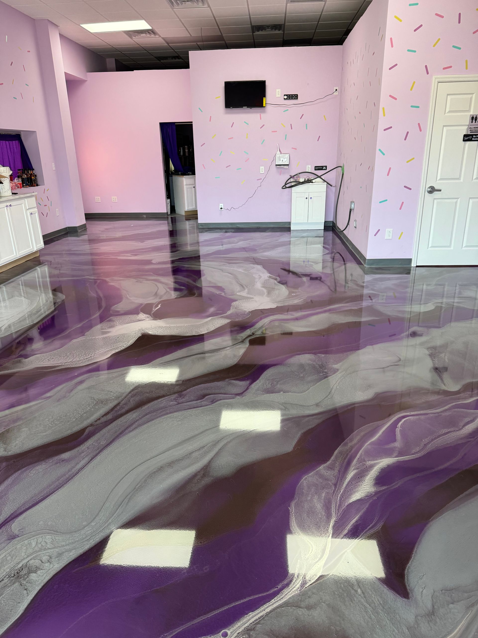 A room with a purple floor and purple walls.