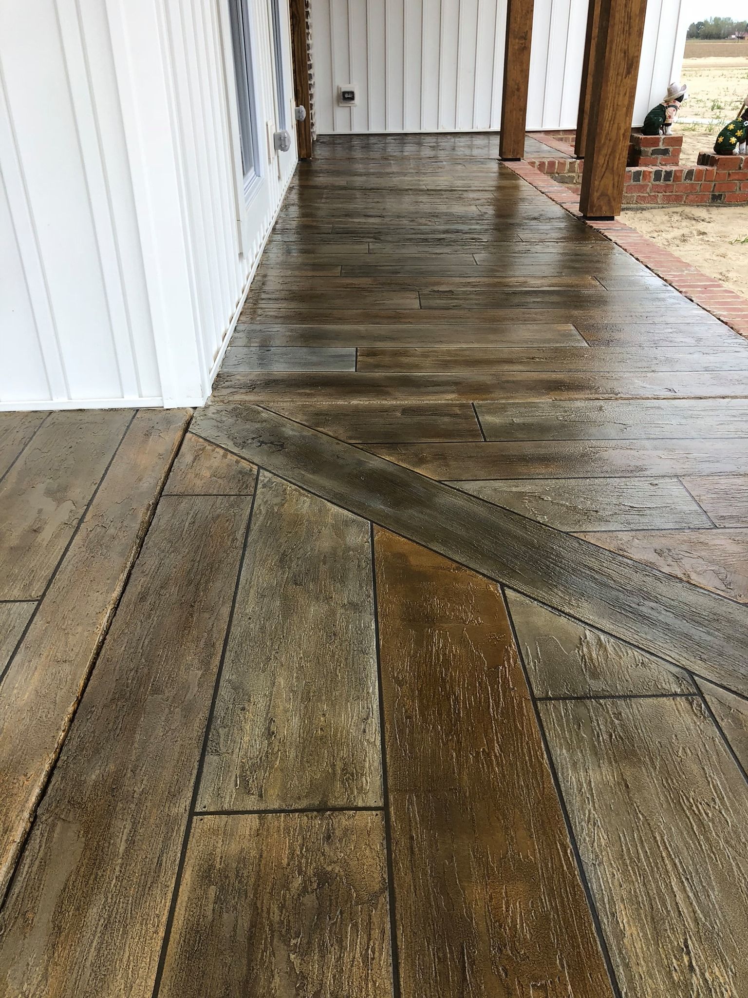 A concrete walkway that looks like wood.