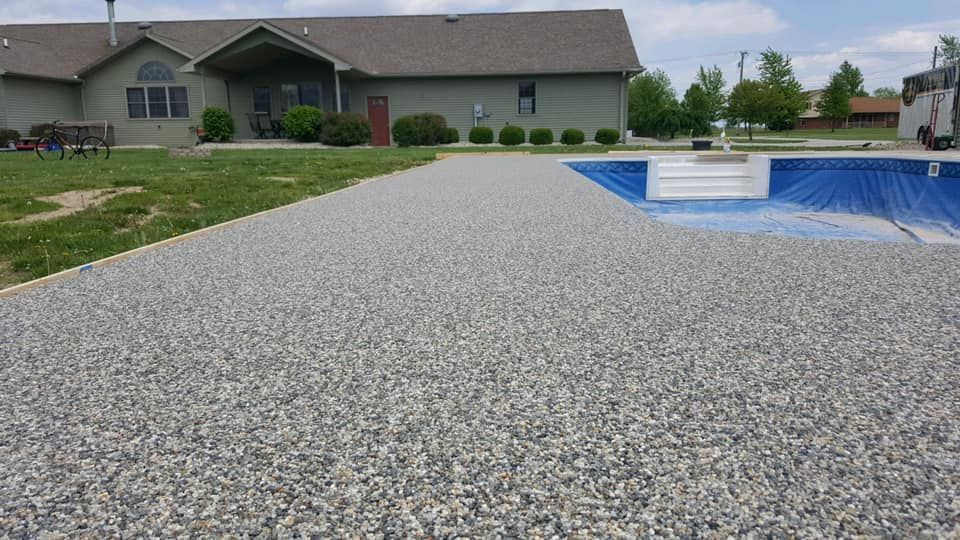 A large house with a swimming pool in front of it