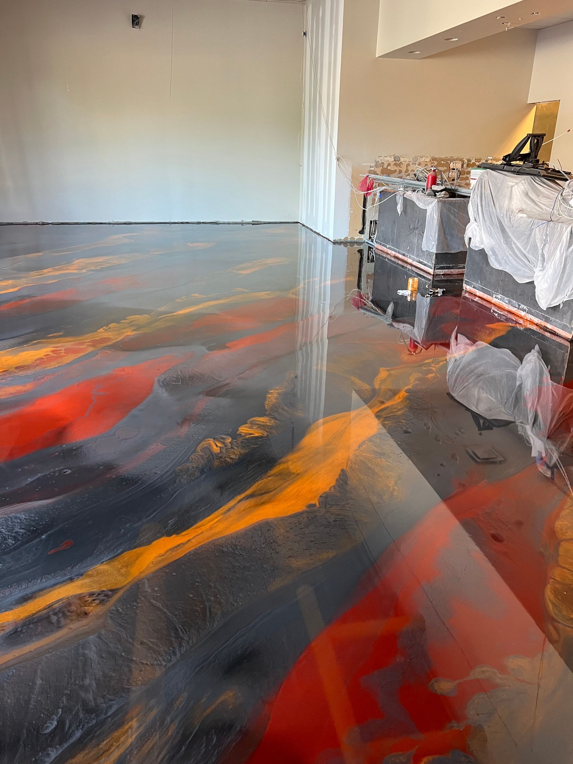 It looks like a painting on the floor of a room.