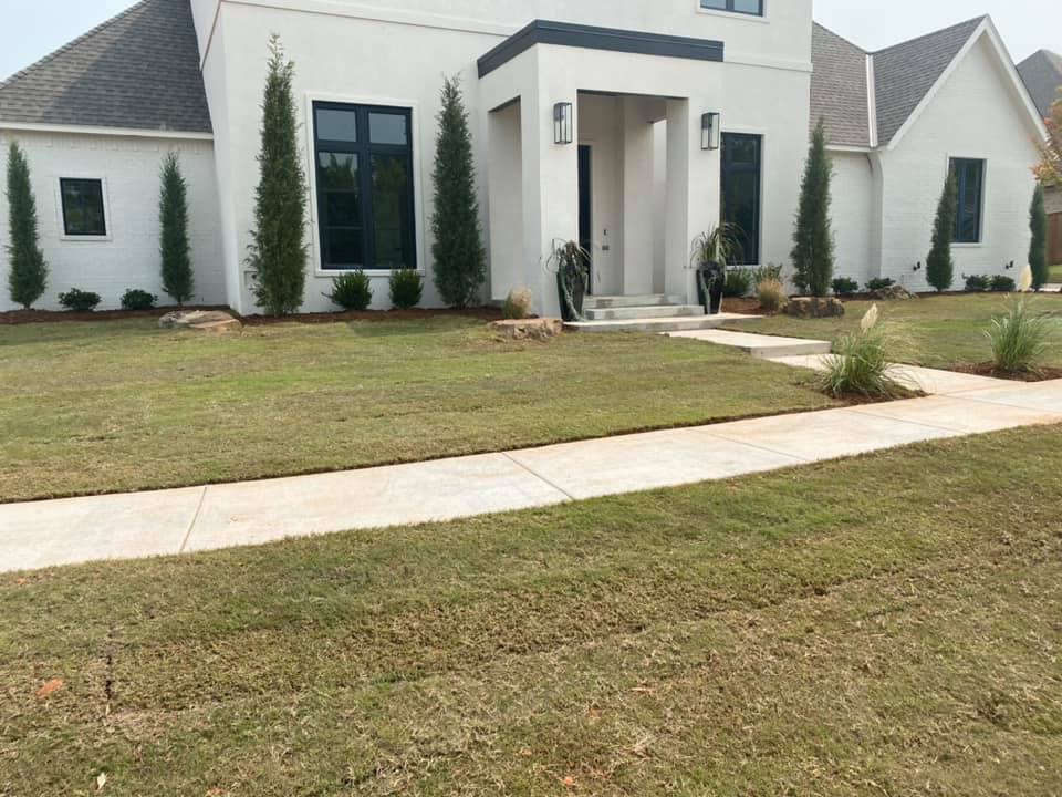 A large white house with a walkway leading to it