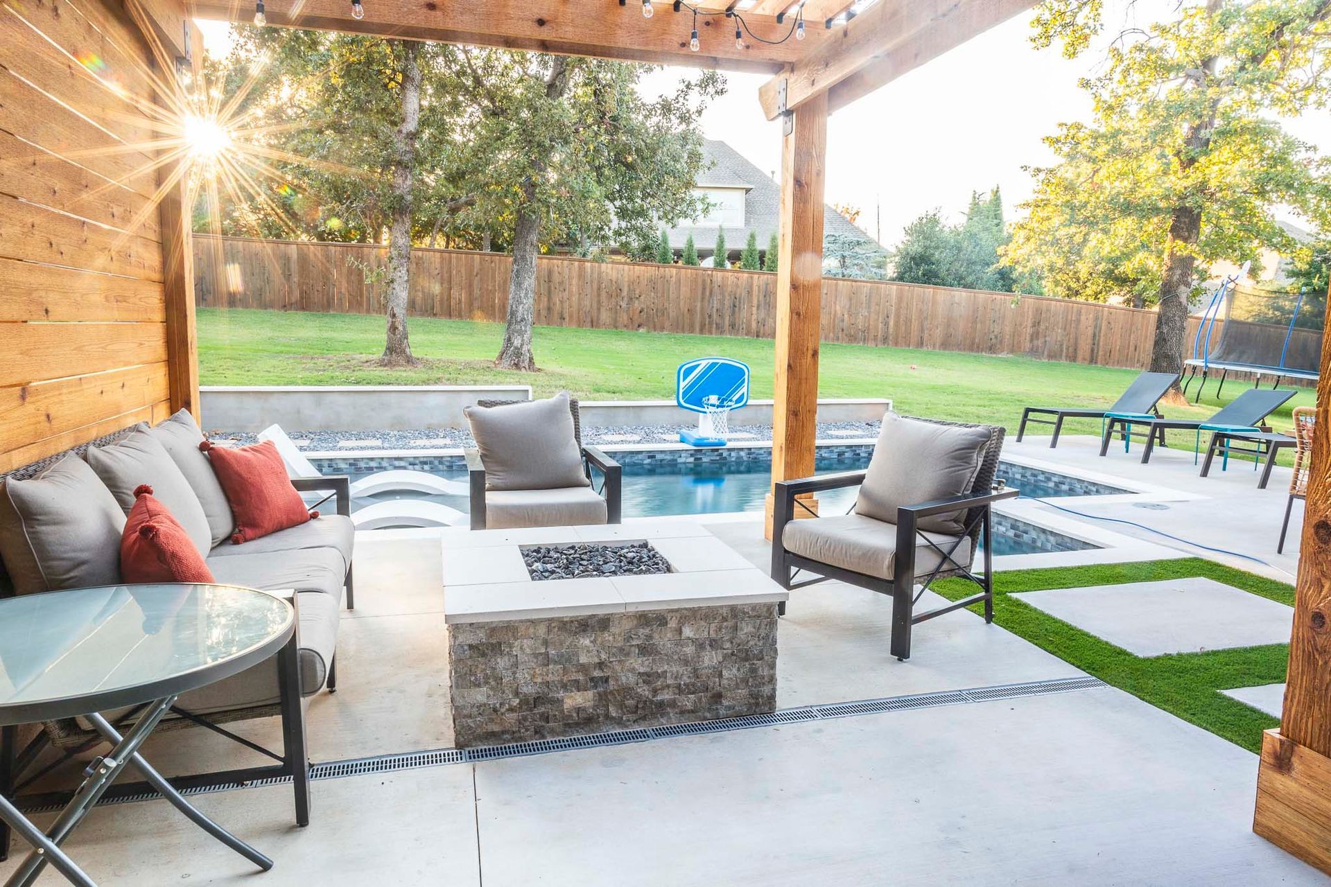 There is a fire pit in the middle of the patio.