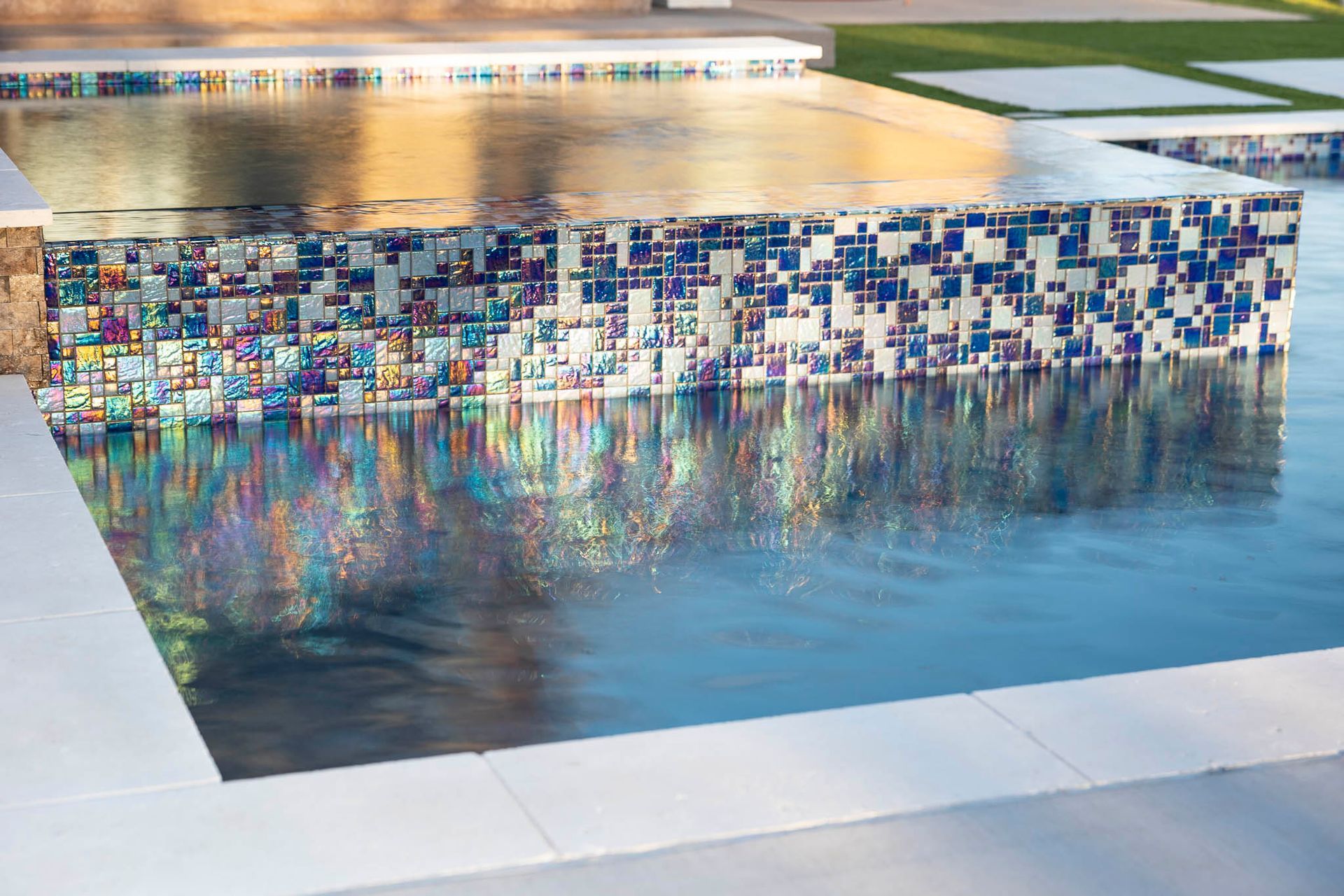 A swimming pool with a bar in the middle of it.