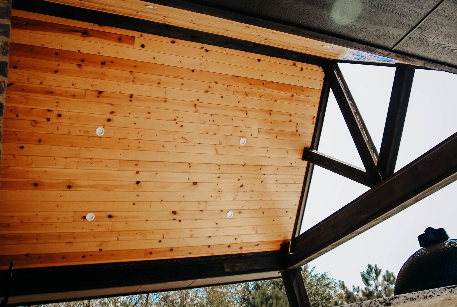 A close up of a wooden ceiling in a building.