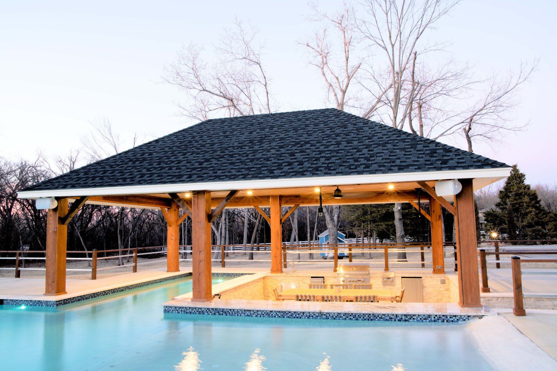 A large swimming pool with a gazebo over it