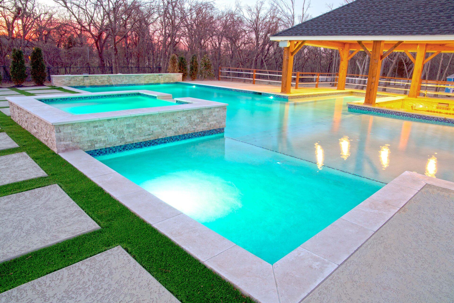 A large swimming pool with a gazebo in the background.