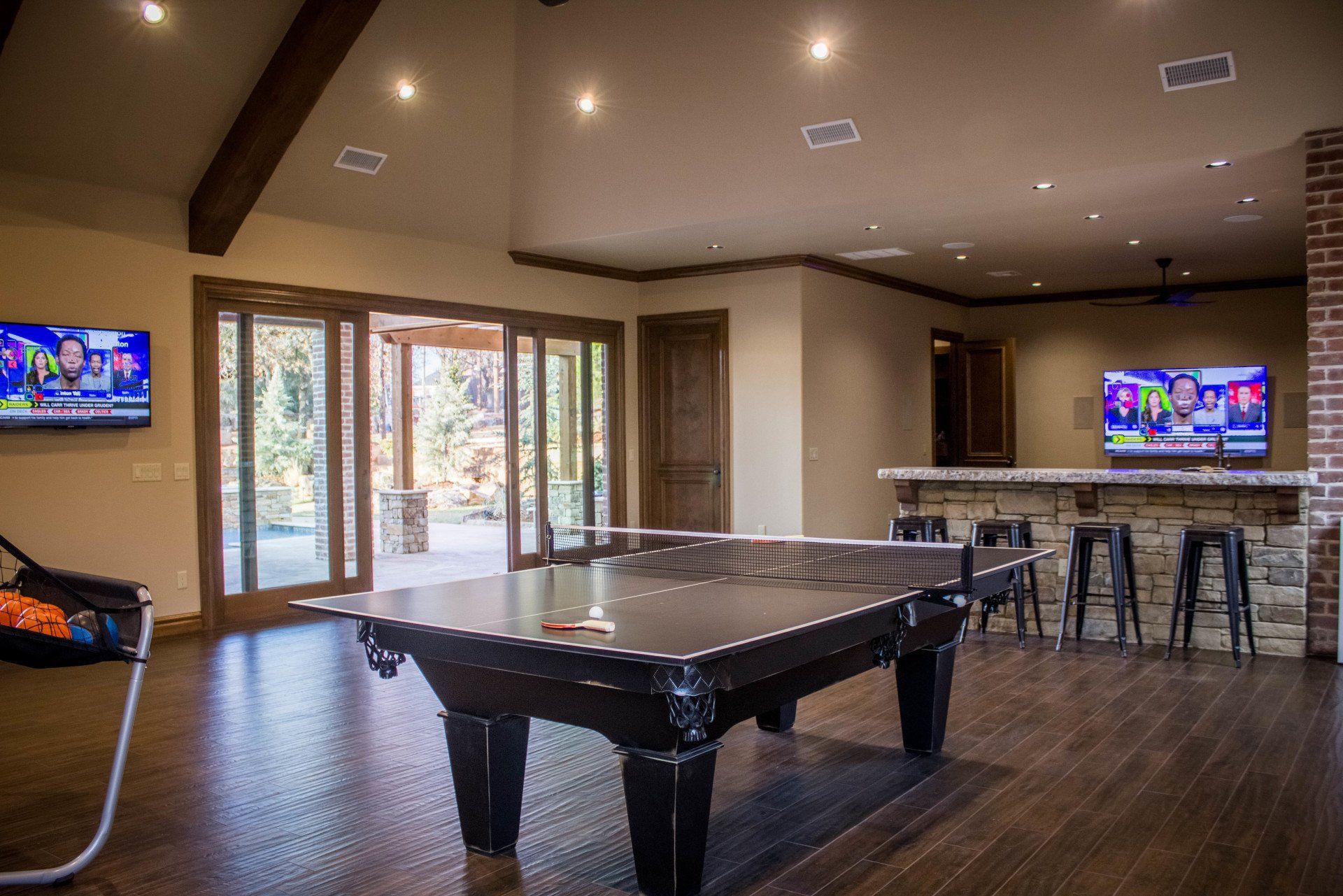 There is a pool table in the middle of the room.