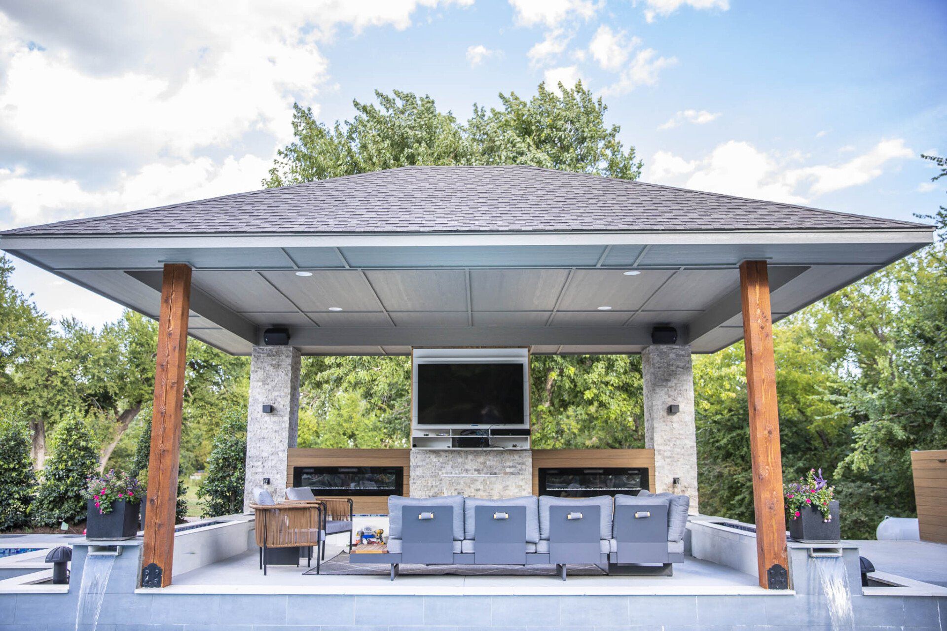 A large gazebo with a television mounted on the roof.