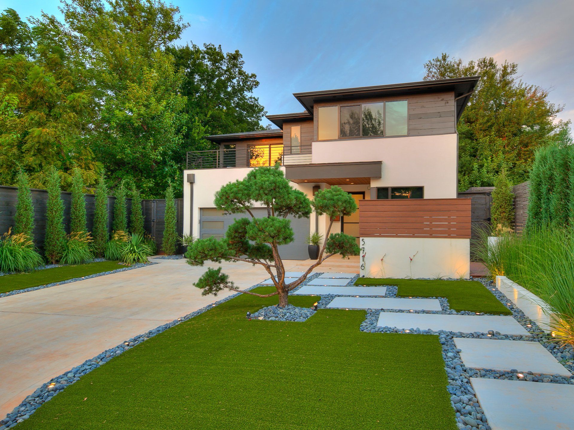 A modern house with a tree in front of it