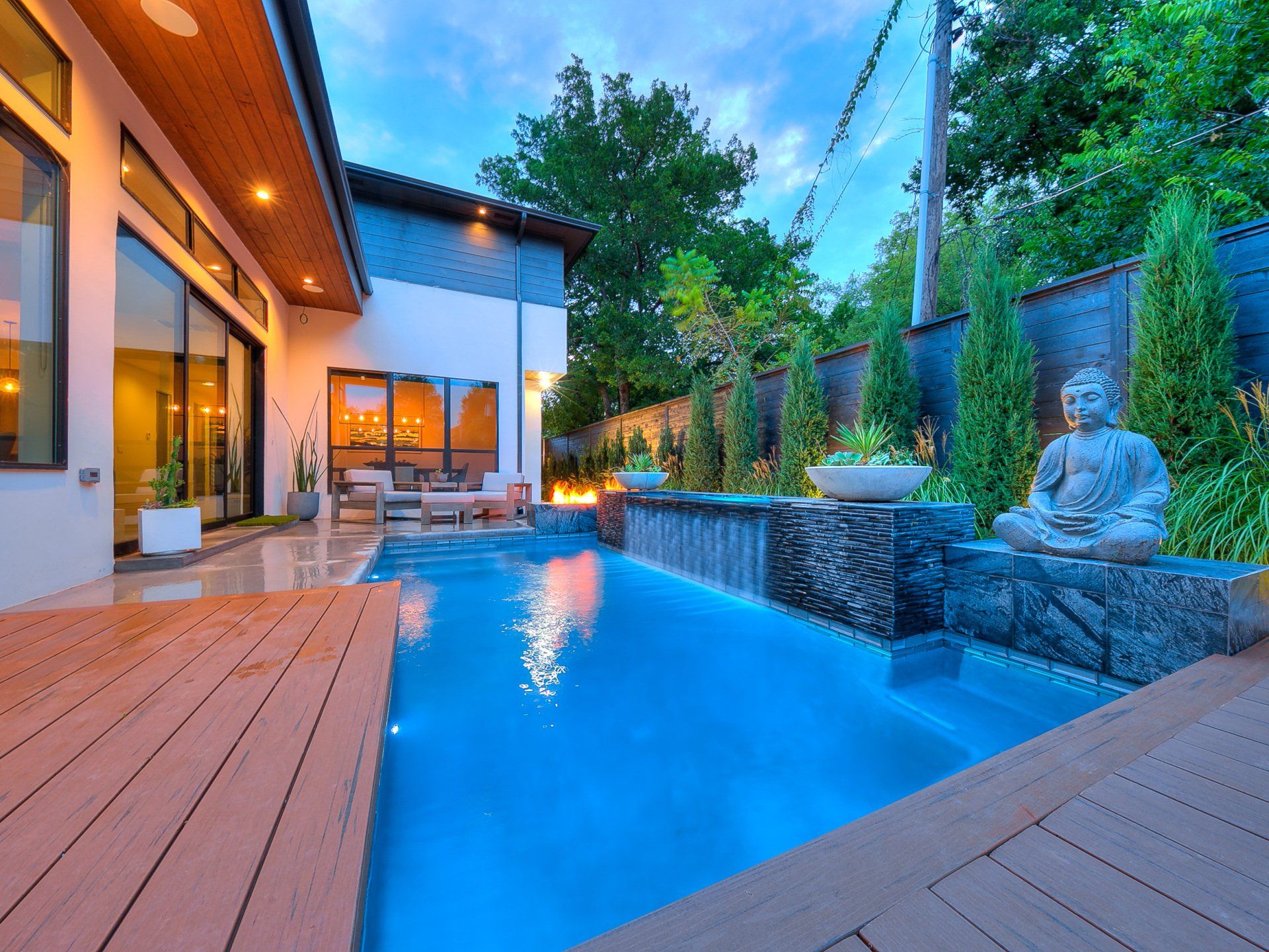 A large swimming pool in the backyard of a house