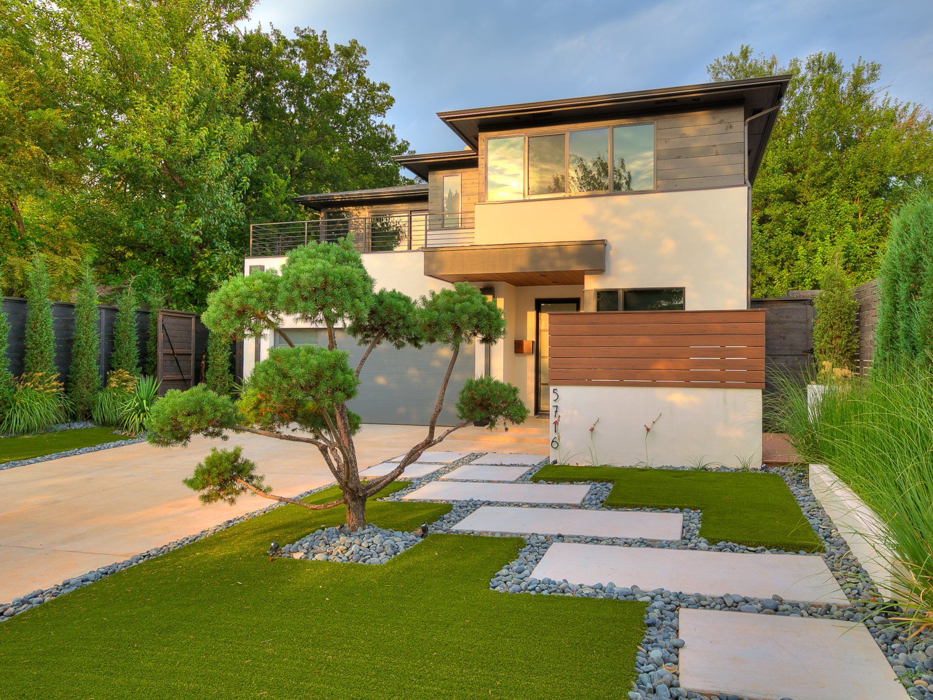 A modern house with a tree in front of it