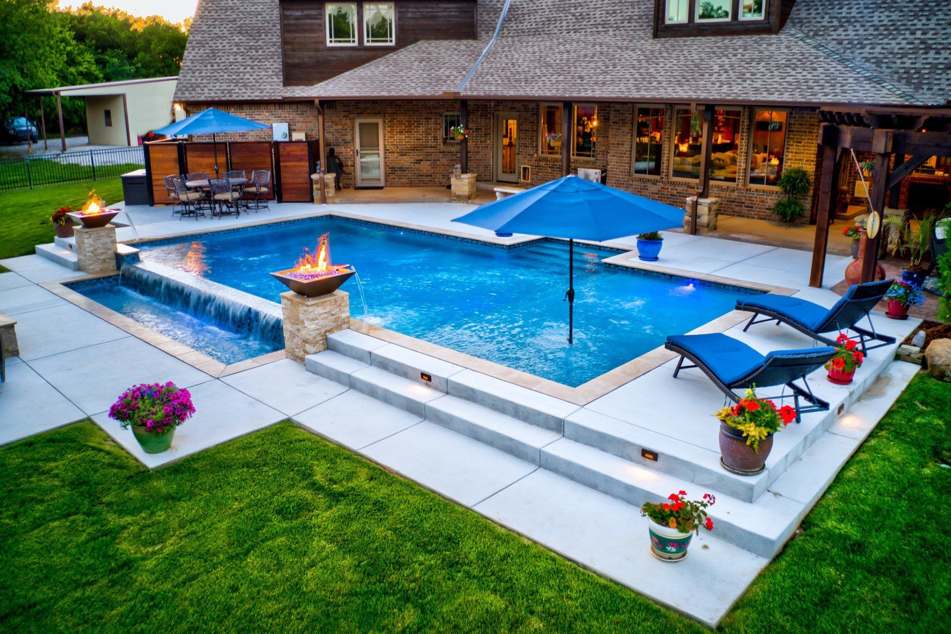 A large swimming pool in the backyard of a house