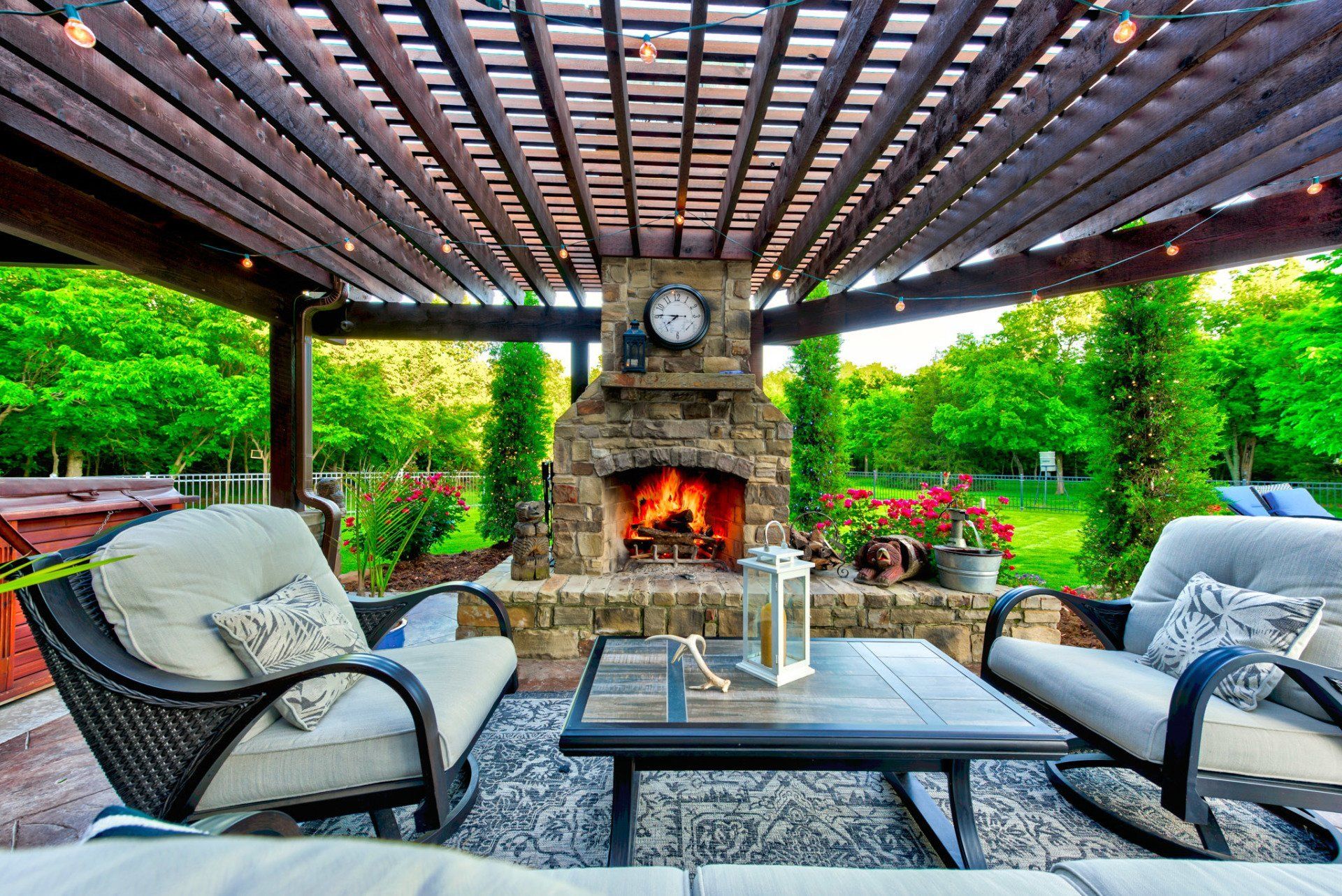 There is a fireplace in the middle of the patio area.