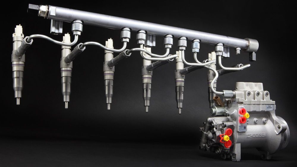 A diesel common rail fuel injection system featuring a high-pressure pump, fuel rail, and five metallic fuel injectors.