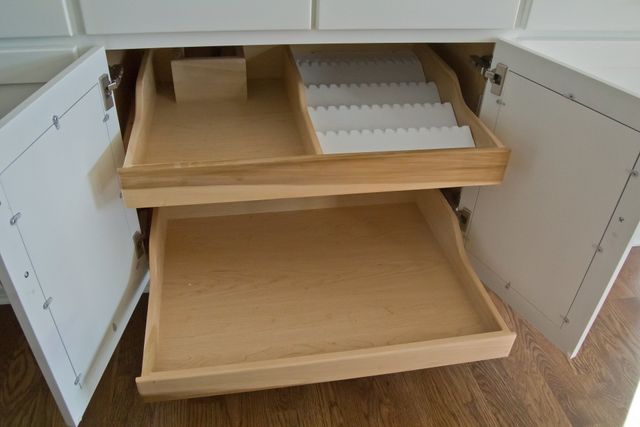 under sink roll outs maximize your cabinet space. www