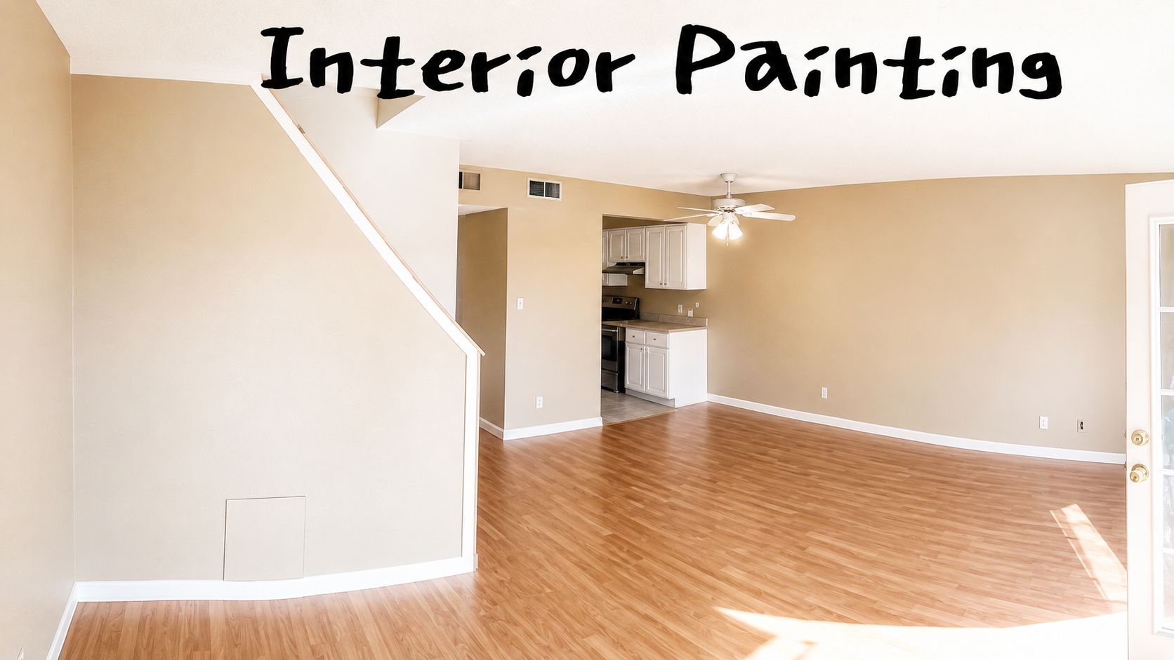 Empty living room with fresh beige interior paint, hardwood floor, and kitchen visible in back