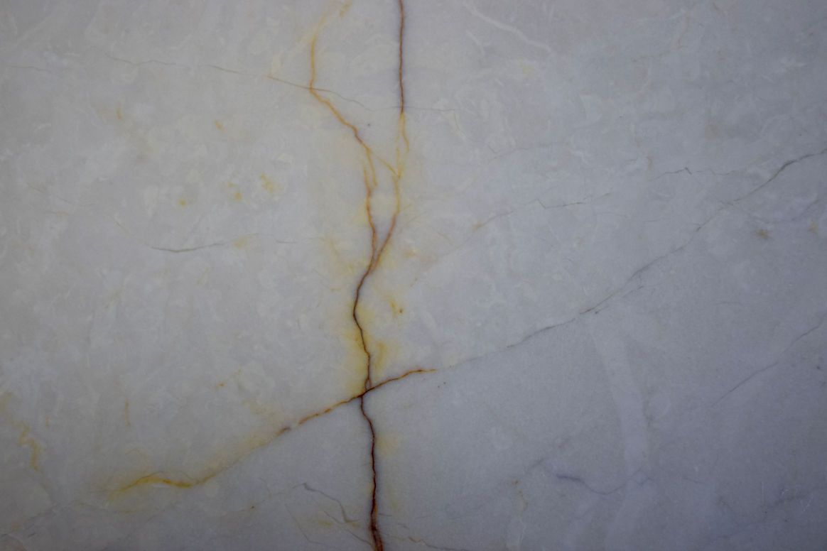 A close up of a brown marble surface