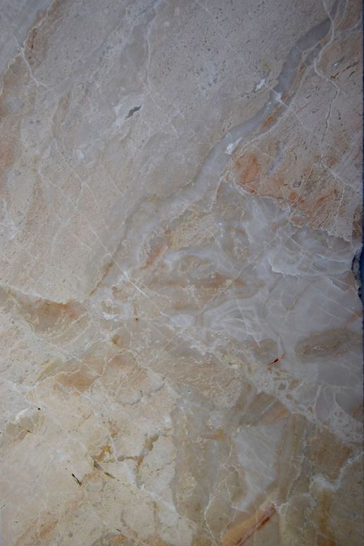 A close up of a piece of paper with a marble texture.