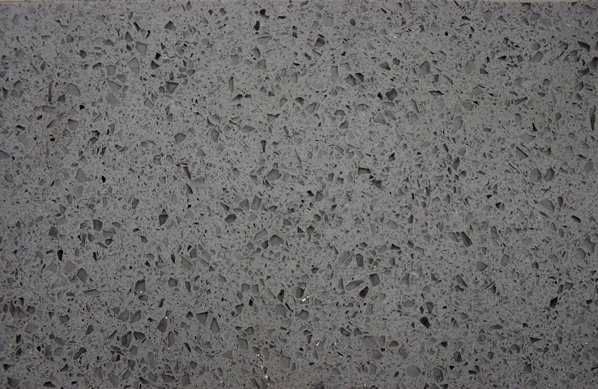 A close up of a gray granite counter top.