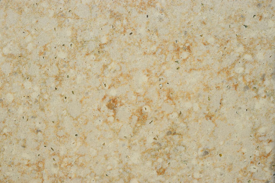 A close up of a beige granite counter top.