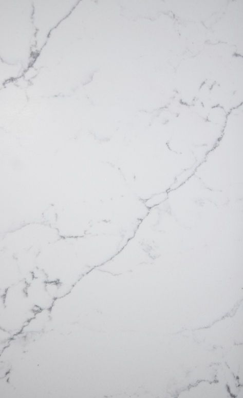 A close up of a white marble counter top.