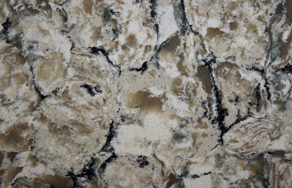 A close up of a granite counter top with a marble texture