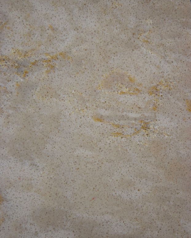 A close up of a marble texture with a few small spots on it