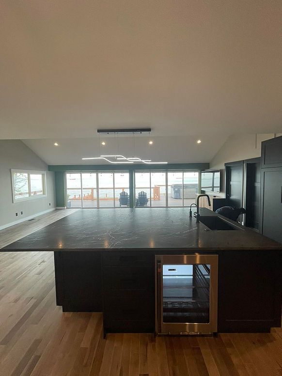 There is a large island in the middle of the kitchen.