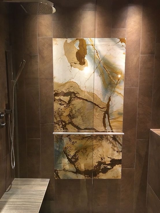 There is a painting on the wall in the shower.