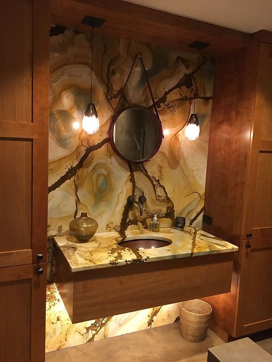 A bathroom with a sink and a mirror on the wall