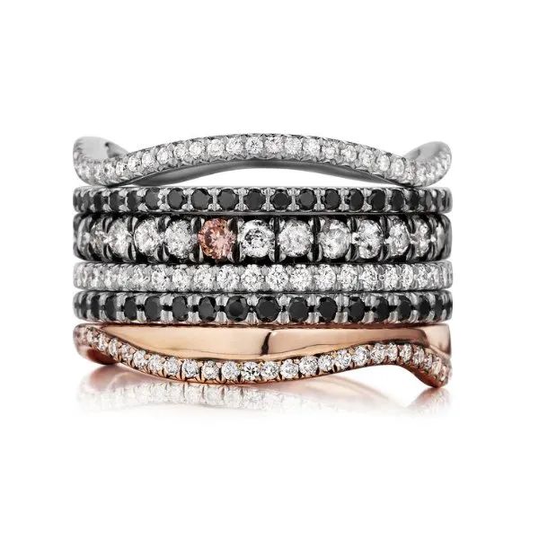 a stack of rings are stacked on top of each other on a white background