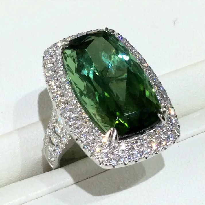 a ring with a emerald stone in the center