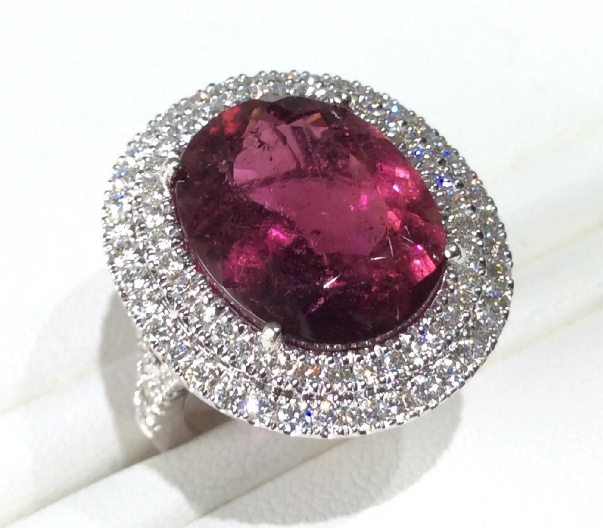 a ring with a large pink stone in the center