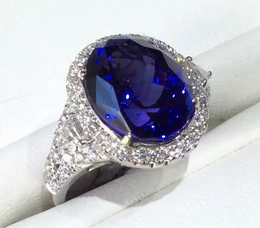 a ring with a sapphire and diamonds
