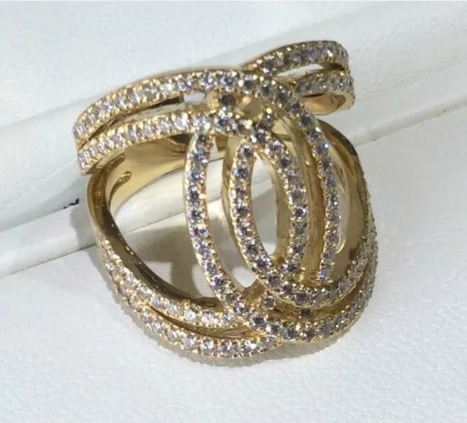 a gold ring with a lot of diamonds on it