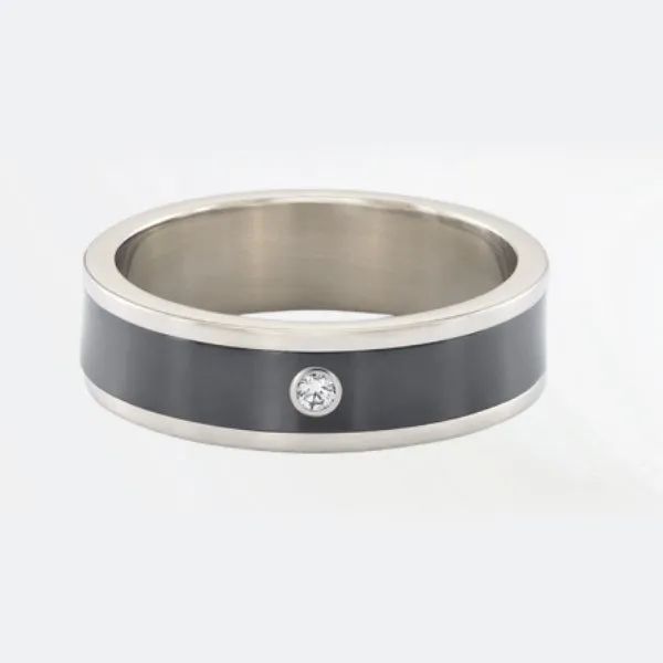 a silver ring with a black band and a diamond in the center