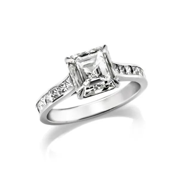 a white gold ring with a square diamond in the center