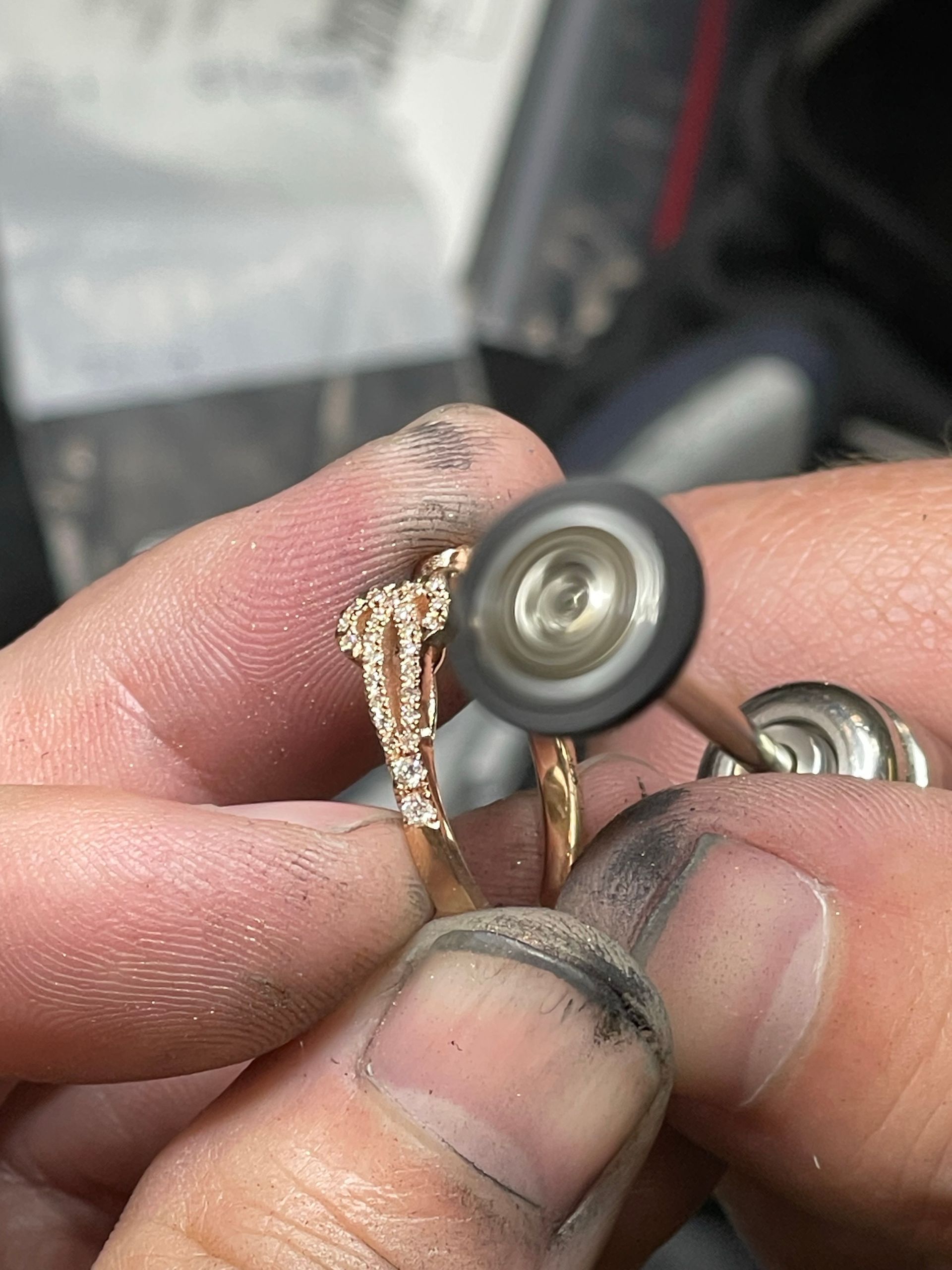 A close up of a person holding a ring in their hand