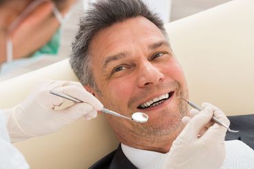 man having his teeth examined