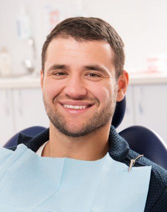 man sitting in a dental clinic