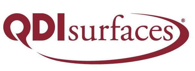 A red and white logo for qdl surfaces.